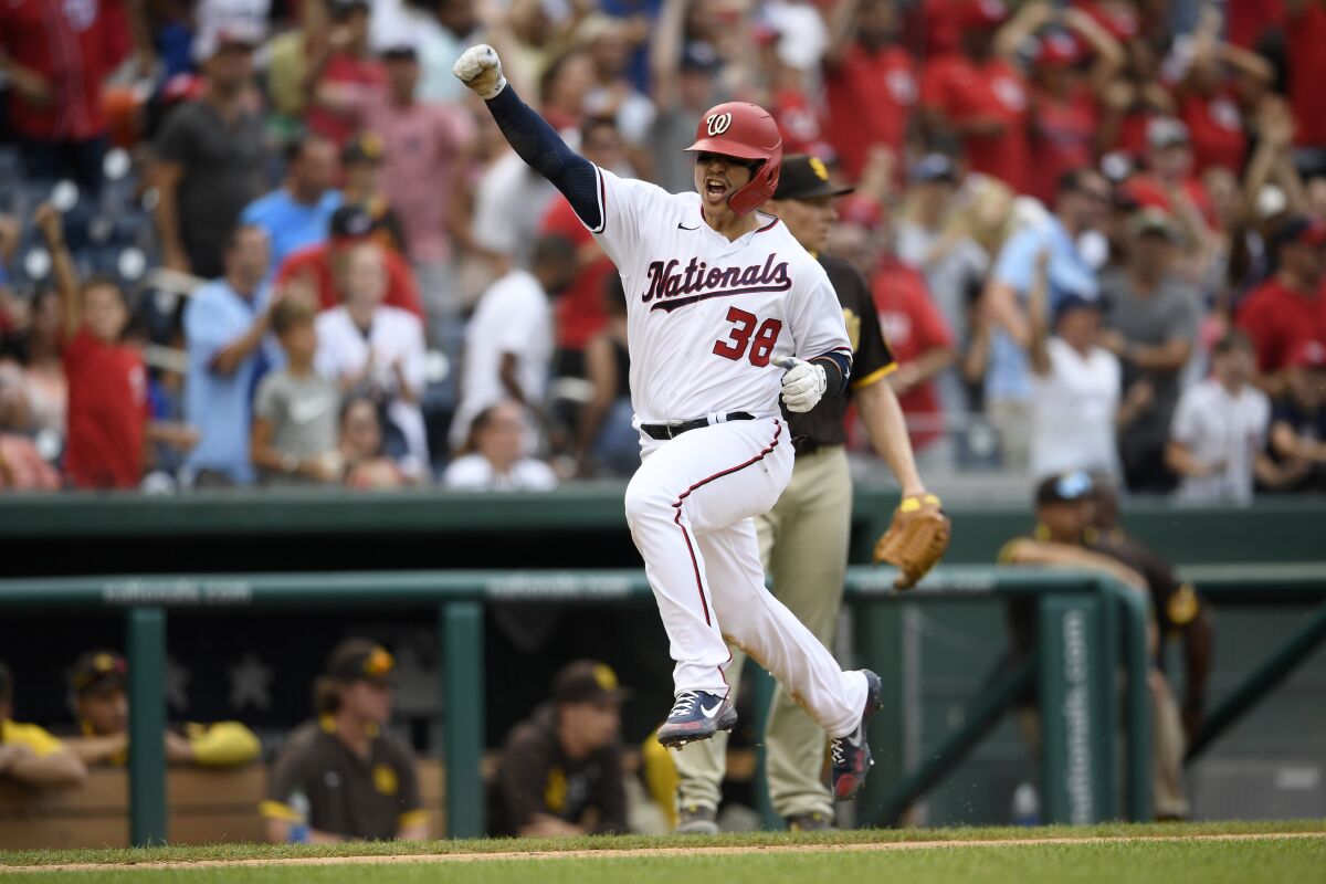 Washington Nationals' Tres Barrera heads home to score the game-winning run on a single by Alcides Escobar during the ninth inning of the team's baseball game against the San Diego Padres, Sunday, July 18, 2021, in Washington. The Nationals won 8-7. (AP Photo/Nick Wass)