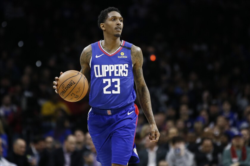 Clippers guard Lou Williams brings the ball up court during a game against the 76ers on Feb. 11 in Philadelphia.