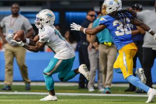 Dolphins wide receiver Tyreek Hill (10) hauls in a 47-yard pas.