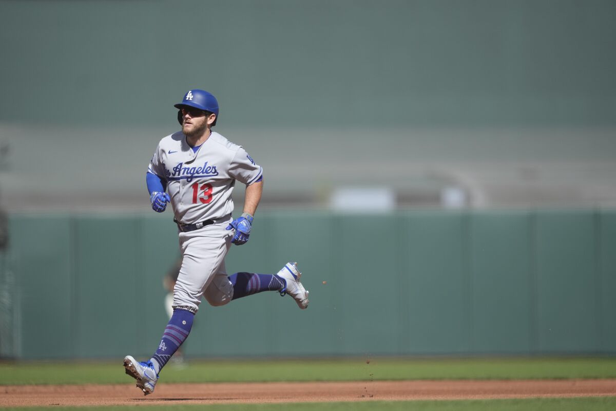 The Dodgers' Max Muncy rounds the bases after hitting a solo home run against the San Francisco Giants.