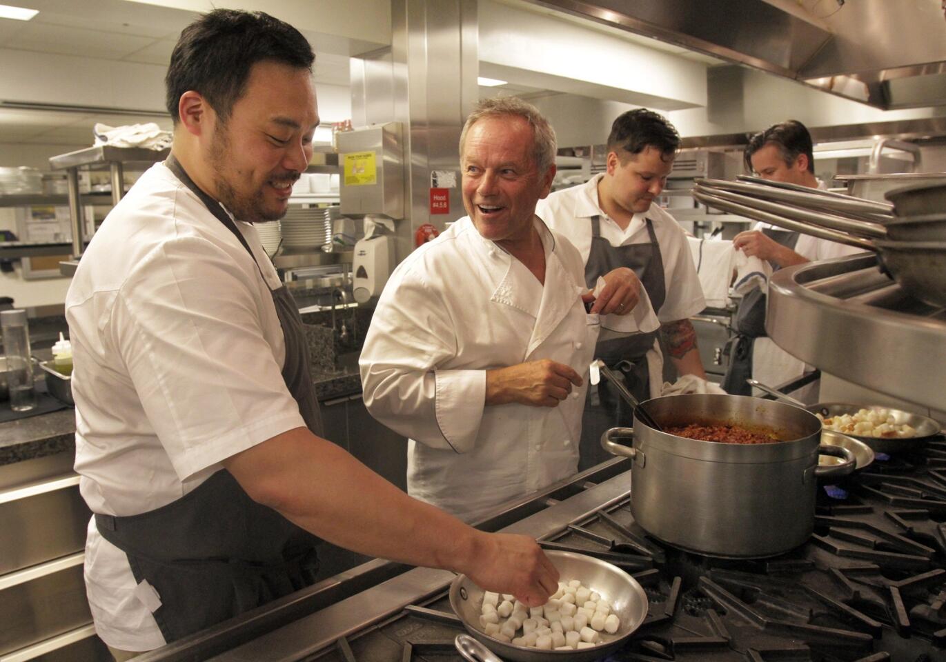 Chefs David Chang, left, and Wolfgang Puck in the kitchen at the Hotel Bel-Air in Beverly Hills.
