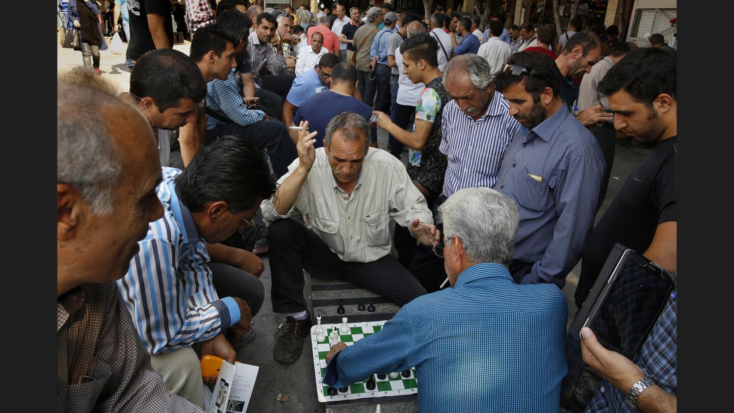 Men gather at Tehran’s Grand Bazaar to play chess. The unemployment rate is at 11%, and it’s even higher for the educated class. Despite the lifting of U.S. sanctions on Iran, many Iranians are frustrated that they haven't seen any economic change over the last year.