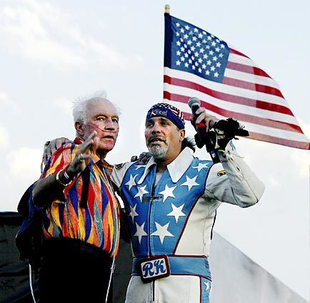 In his later years, a lung ailment tethered Knievel to an oxygen tank. Here he is with his son, Robbie, at Evel Knievel Days in Butte, Mont.