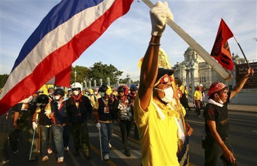 Anti-government demonstrators march on Thailand's Parliament Monday, Nov. 24, 2008, in Bangkok. The group, which calls itself the People's Alliance for Democracy, is calling on the end of the current government which they claim is a puppet administration of former Prime Minister Thaksin Shinawatra. (AP Photo/Wason Wanichakorn)