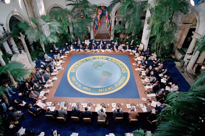 People sit around a large table.