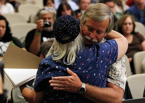 Ron Thomas embraces Susan Wright after she delivered an emotional plea to the Fullerton City Council for better treatment of the mentally ill. Thomas and hundreds of supporters attended the meeting hours after the release of the coroner's report on the death of his son, Kelly, at the hands of Fullerton police.