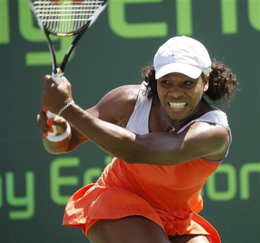 Serena Williams waits to see if her ball hit to Li Na, of China, is in bounds during their match at the Sony Ericsson Open tennis tournament in Key Biscayne, Fla. Wednesday, April 1, 2009. (AP Photo/J Pat Carter)