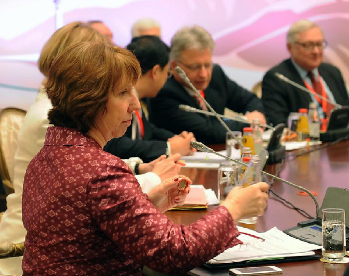 European Union foreign policy chief Catherine Ashton at the table with other representatives taking part in talks on Iran's nuclear program in the Kazakh city of Almaty on Friday.