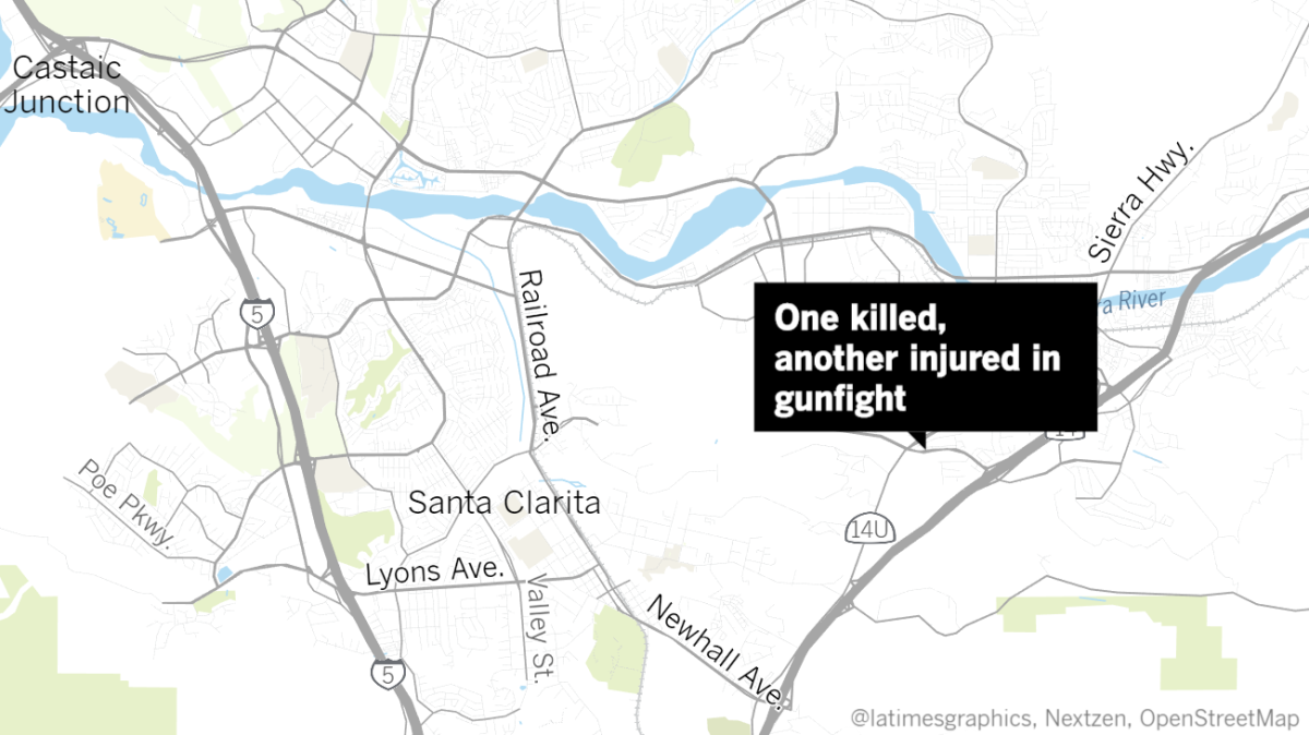 A gunfight during an attempted robbery in Santa Clarita left one man dead and another injured, according to the Los Angeles County Sheriff's Department.