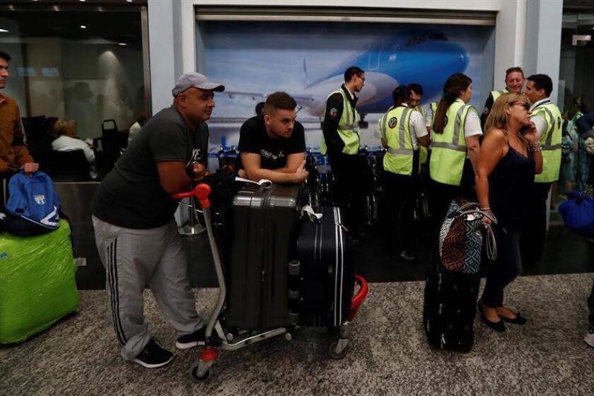 Passengers wait for flights on Jan. 17, 2019, at the Buenos Aires Aeroparque. Between 10 and 15 flights were delayed in the early morning hours due to pilot union assemblies. EPA-EFE/Juan Ignacio Roncoroni