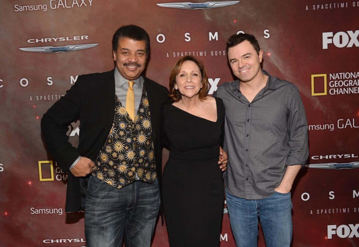 From left, host Neil deGrasse Tyson;, writer, executive producer and director Ann Druyan; and executive producer Seth MacFarlane attend the premiere of Fox's "Cosmos: A SpaceTime Odyssey" at The Greek Theatre in Los Angeles.