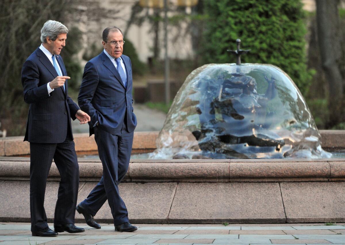 Russian Foreign Minister Sergei Lavrov, right, talks with U.S. Secretary of State John F. Kerry in Moscow.