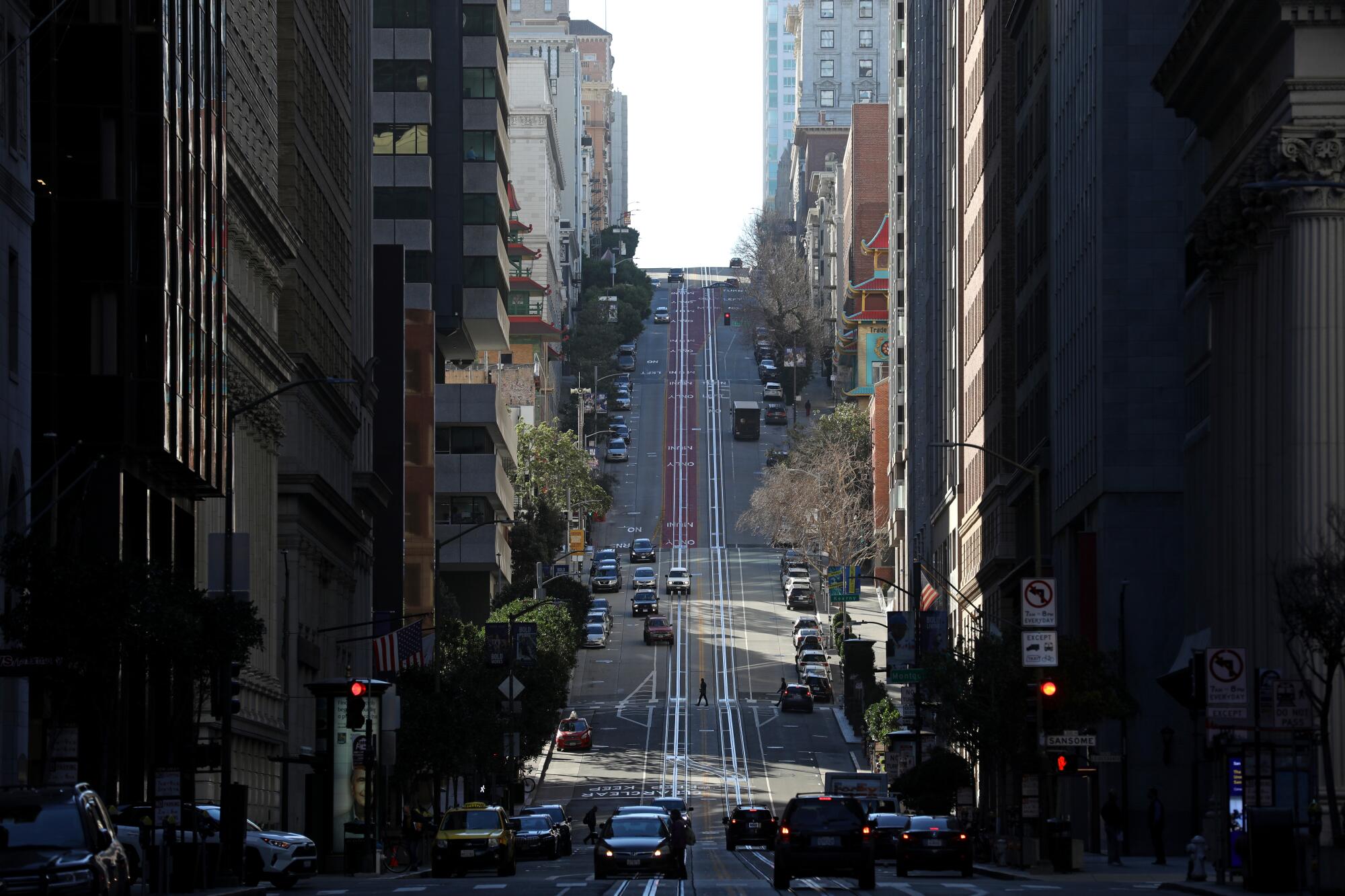 California Street in downtown San Francisco with buildings and cars but no cable cars on its tracks.