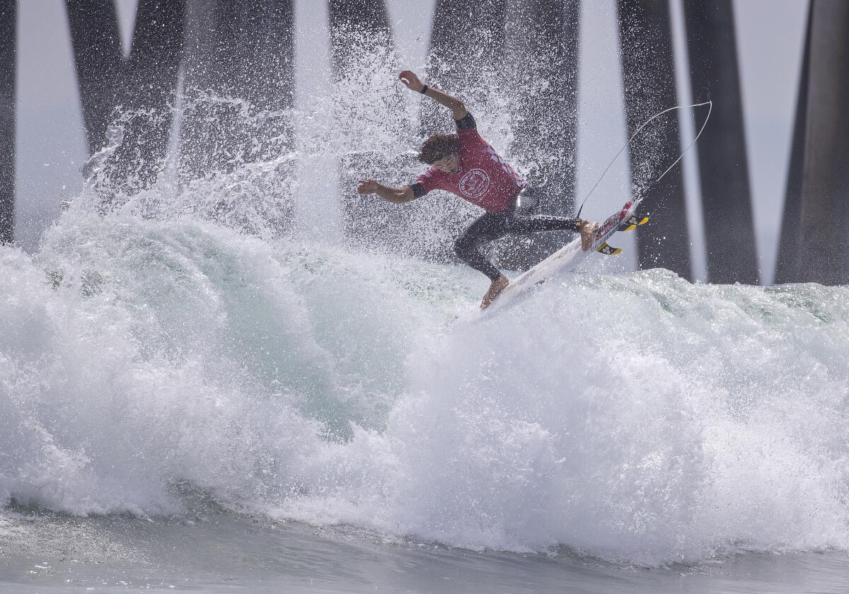 Yago Dora does an aerial during the Vans US Open of Surfing men's final at Huntington Beach on Sunday.
