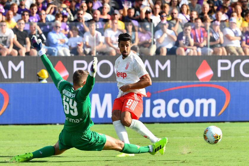 Fiorentina's Polish goalkeeper Bartlomiej Dragowski (L) clears a ball under pressure from Juventus' German midfielder Sami Khedira during the Italian Serie A football match Fiorentina vs Juventus on September 14, 2019 at the Artemio-Franchi stadium in Florence. (Photo by Vincenzo PINTO / AFP)VINCENZO PINTO/AFP/Getty Images ** OUTS - ELSENT, FPG, CM - OUTS * NM, PH, VA if sourced by CT, LA or MoD **