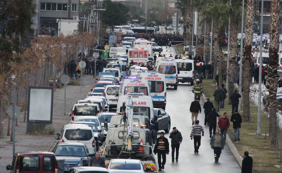 Ambulances are parked near the site of an explosion Jan. 5 outside the courthouse in Izmir, Turkey.