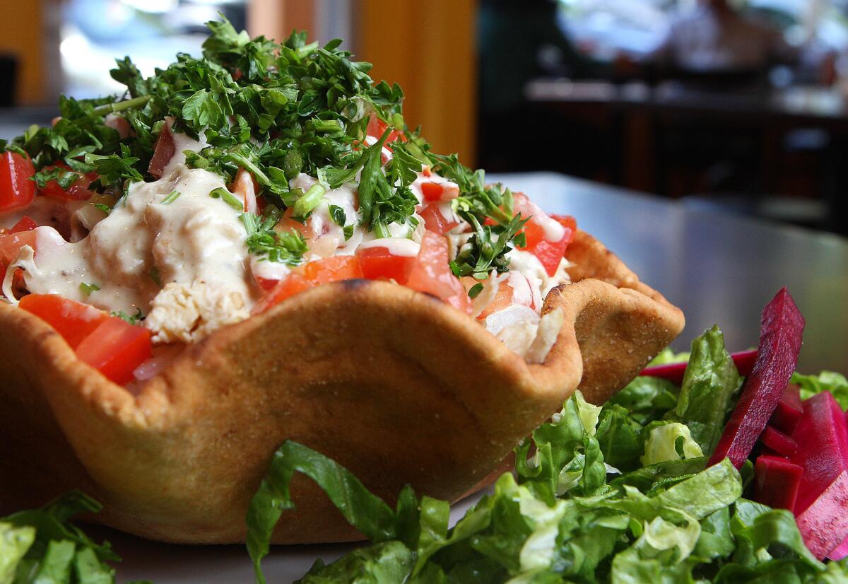 A rotisserie chicken pita at Seasoning Alley in Montrose on Thursday, May 8, 2014.