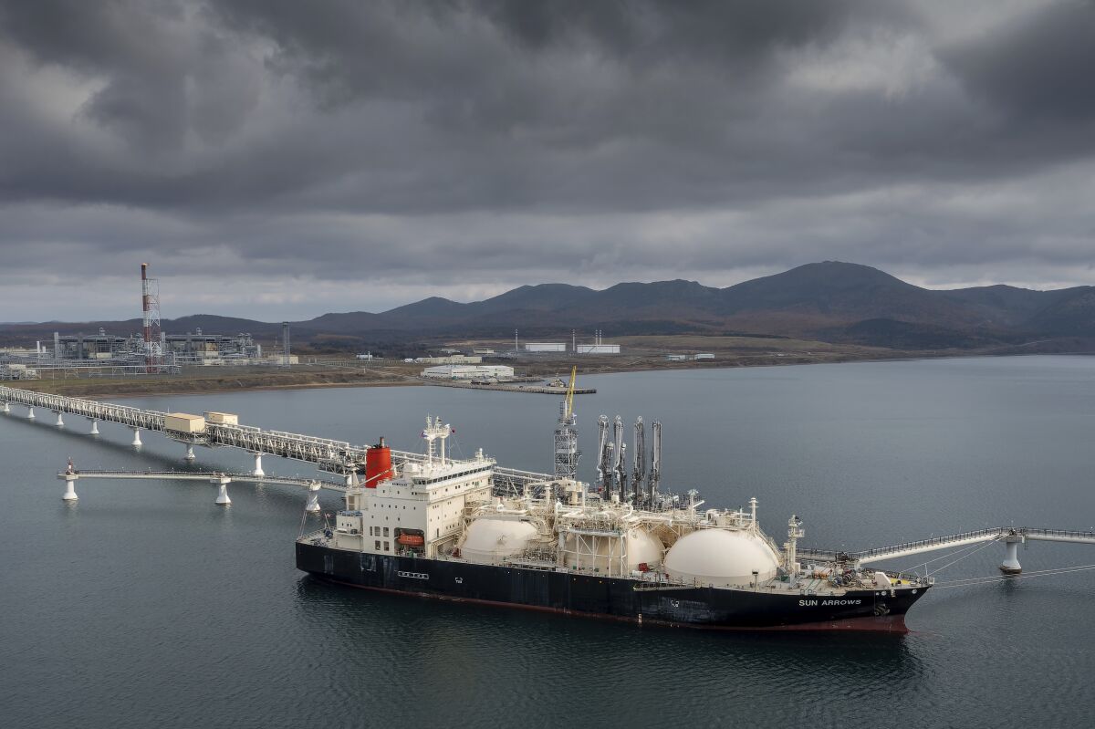 FILE - The tanker Sun Arrows loads its cargo of liquefied natural gas from the Sakhalin-2 project in the port of Prigorodnoye, Russia, on Friday, Oct. 29, 2021. Europe's natural gas woes are far from over in Jan. 2022. Prices are high. Underground reserves that are relied on in cold weather are low. Russia's state-owned Gazprom isn't selling as much spot gas as it used to. The pipeline operators have told the European Union's executive commission that if there's a cold winter, the continent's gas companies will need to import more than they have in the past. (AP Photo, File)