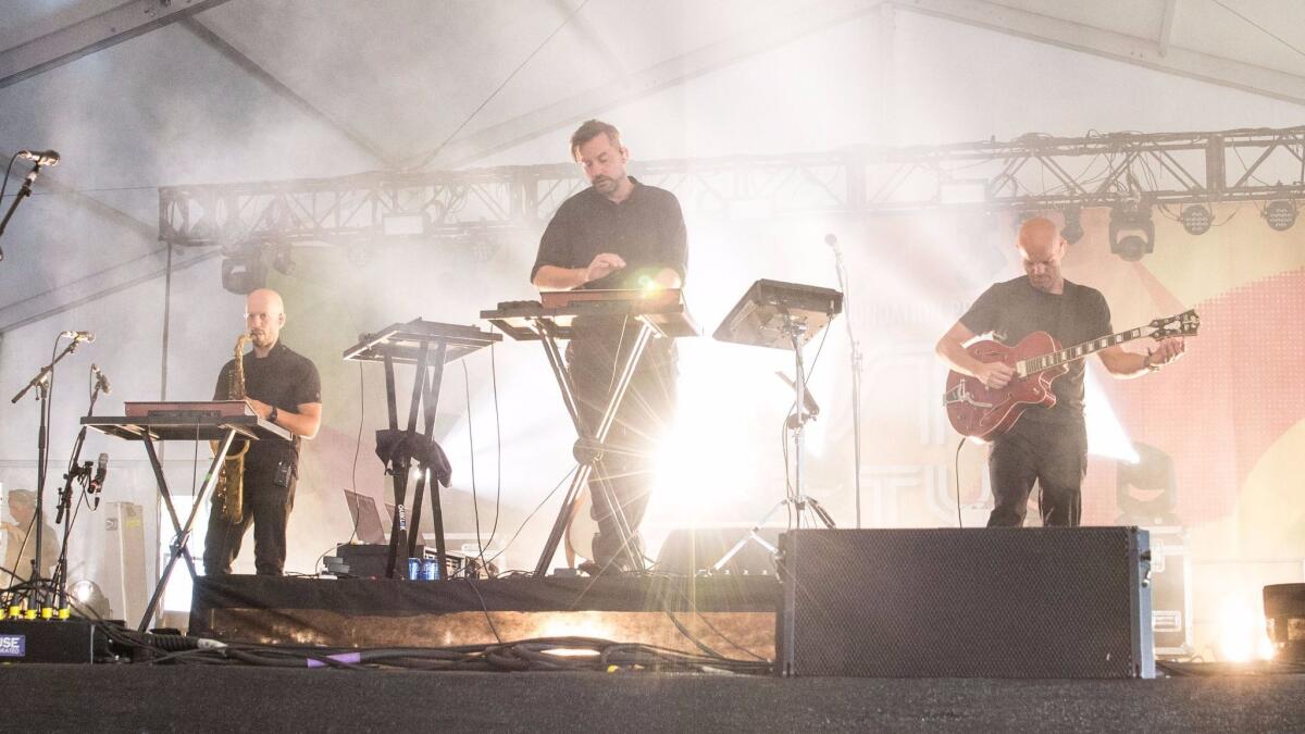 Simon Green, center, as Bonobo, performing earlier this year in Austin, Texas.