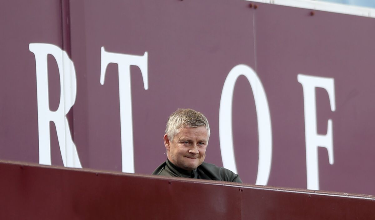 Manchester United's manager Ole Gunnar Solskjaer looks out from the stands during the English Premier League soccer match between Aston Villa and Manchester United at Villa Park in Birmingham, England, Sunday, May 9, 2021. (Nick Potts/Pool via AP)