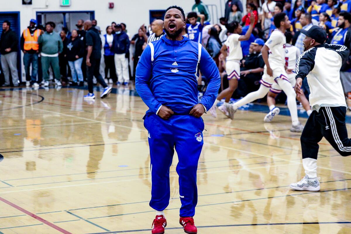 Washington Prep coach Jovante King is excited after overtime win over Crenshaw.