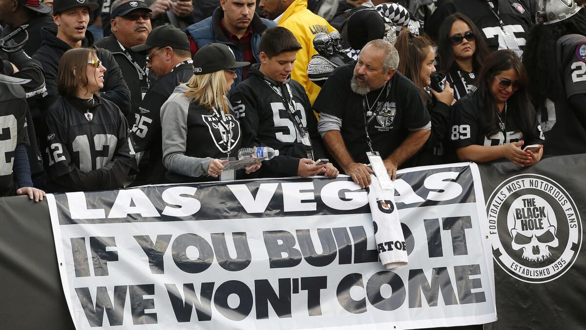 These Oakland Raiders fans are not keen on the idea of the franchise moving to Las Vegas. (Tony Avelar / Associated Press)