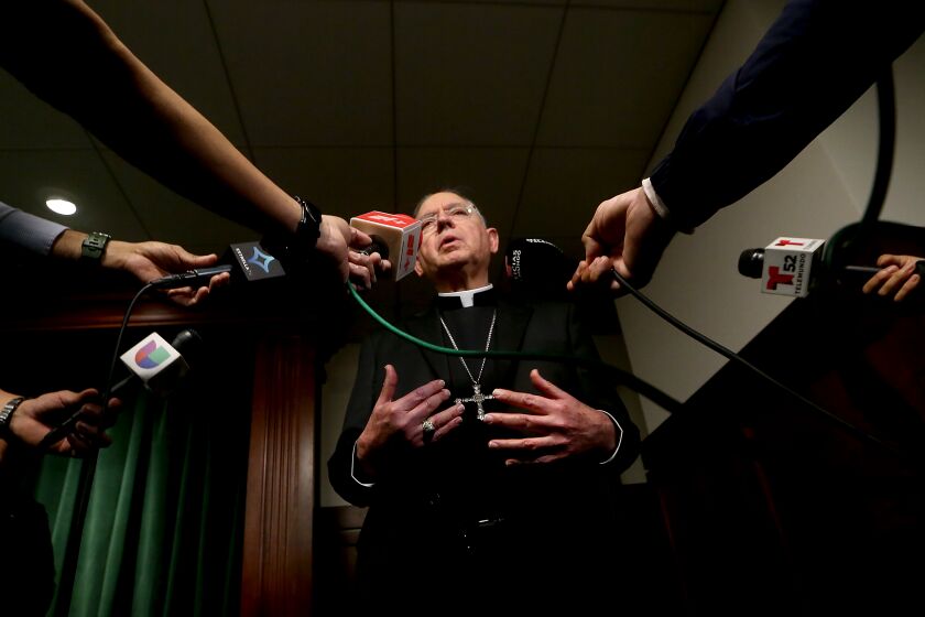LOS ANGELES, CALIF. - FEB. 20, 2023. Los Angeles Archbishop Jose Gomez talks with reporters during a press conference in downtown Los Angeles on Monday, Feb. 20, 2023, to announce the arrest of a suspect in the murder of Roman Catholic Bishop David O'Connell. Authorities took 65-year-old Carlos Medina into custody early Sunday morning. He is the husband of the housekeeper where O'Connell lived. (Luis Sinco / Los Angeles Times)