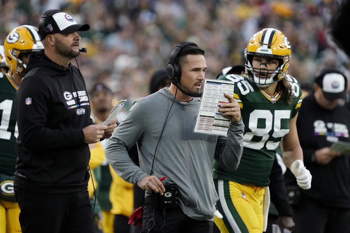 Green Bay Packers head coach Matt LaFleur watches from the sideline during the second half of an NFL football game against the New England Patriots, Sunday, Oct. 2, 2022, in Green Bay, Wis. (AP Photo/Morry Gash)