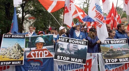 Russian political activists protest outside the Georgian embassy in Moscow