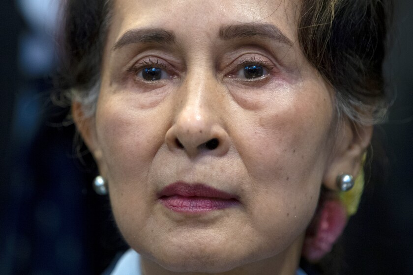 FILE - Myanmar's leader Aung San Suu Kyi waits to address judges of the International Court of Justice on the second day of three days of hearings in The Hague, Netherlands on Dec. 11, 2019. (AP Photo/Peter Dejong, File)