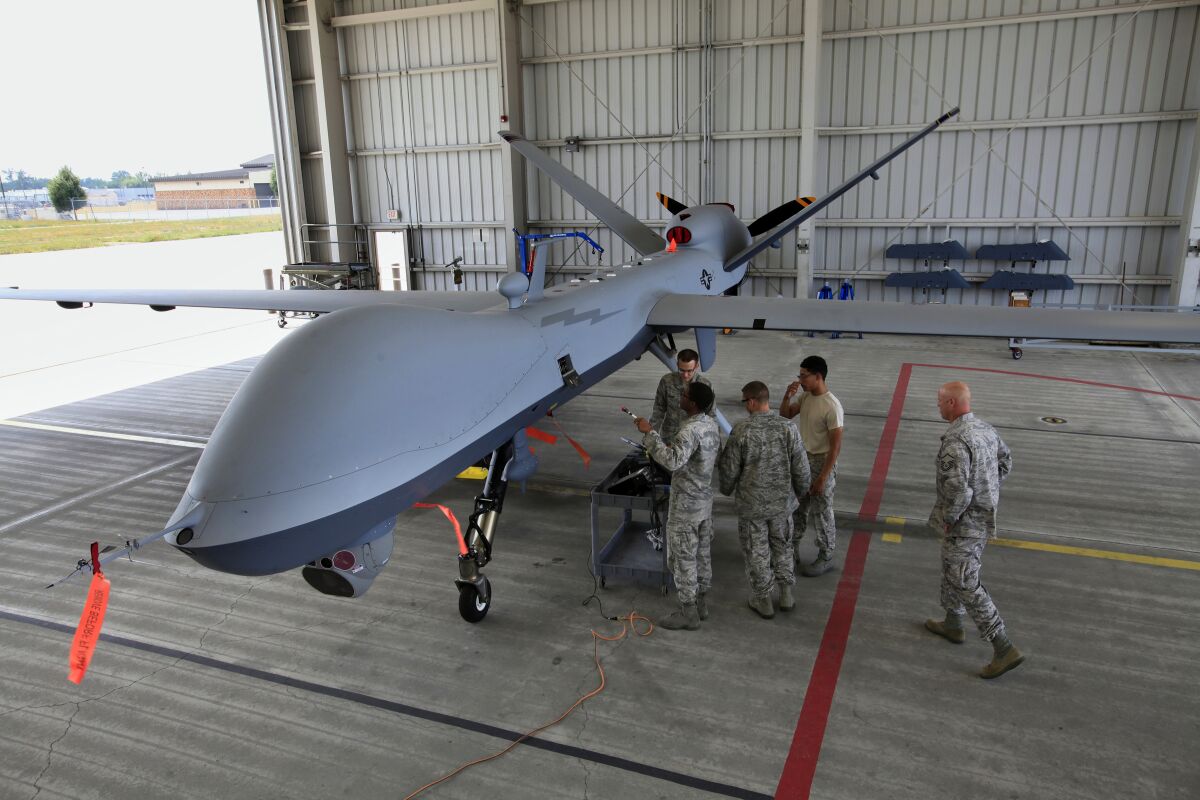 Members of the Air National Guard learn how to do maintenance on the MQ-Reaper in 2012.