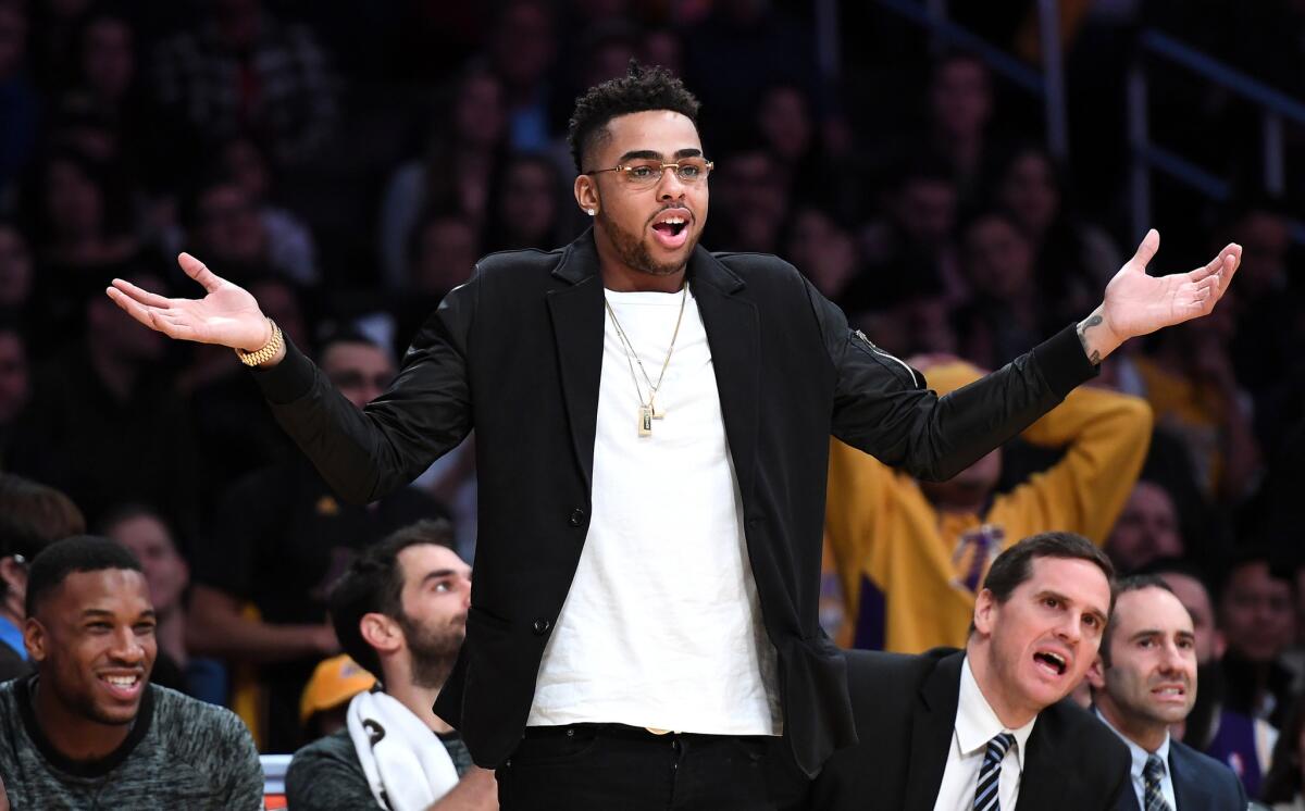 Sidelined because of a knee injury, Lakers guard D'Angelo Russell reacts to a referee's call during a game against the Spurs at Staples Center on Nov. 18.