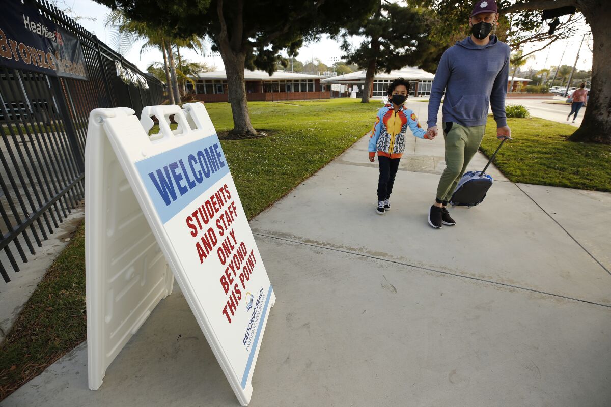 A student returns this week to reopened campus in Redondo Beach.
