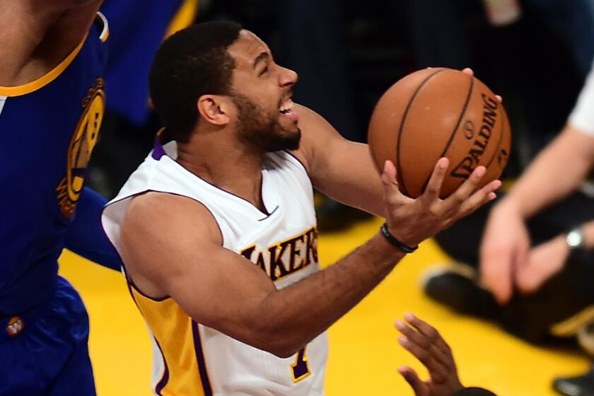 Lakers guard Xavier Henry drives to the basket during a loss to the Golden State Warriors on Nov. 16. Henry tore an Achilles' tendon in practice on Nov. 24 and is out for the season.