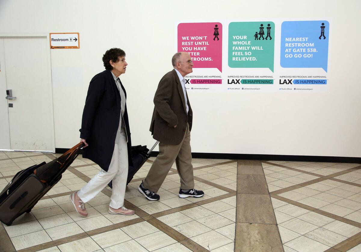 Passengers walk at the Delta Airlines terminal, which is part of an ongoing renovation at Los Angeles International Airport.