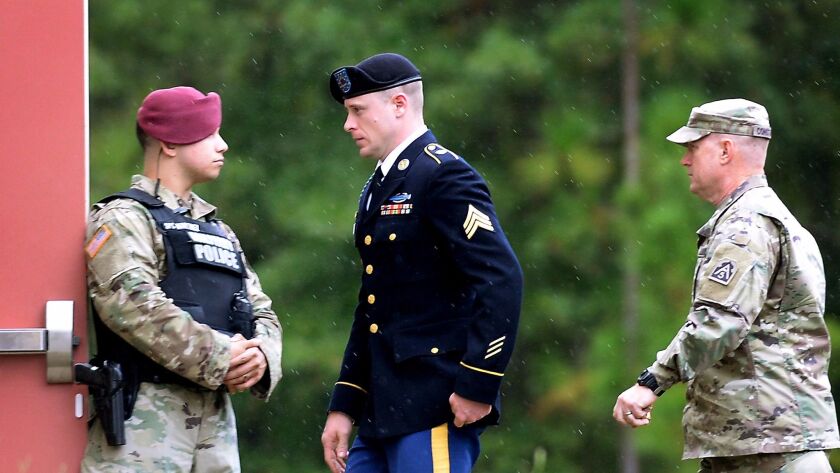 Sgt. Robert Bowdrie "Bowe" Bergdahl is escorted to the Ft. Bragg military courthouse Oct. 16 after a lunch recess.