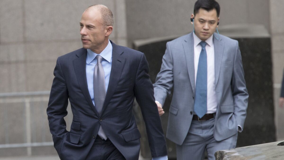 Michael Avenatti, left, attorney and spokesperson for adult film actress Stormy Daniels, arrives at federal court in Manhattan on Friday.