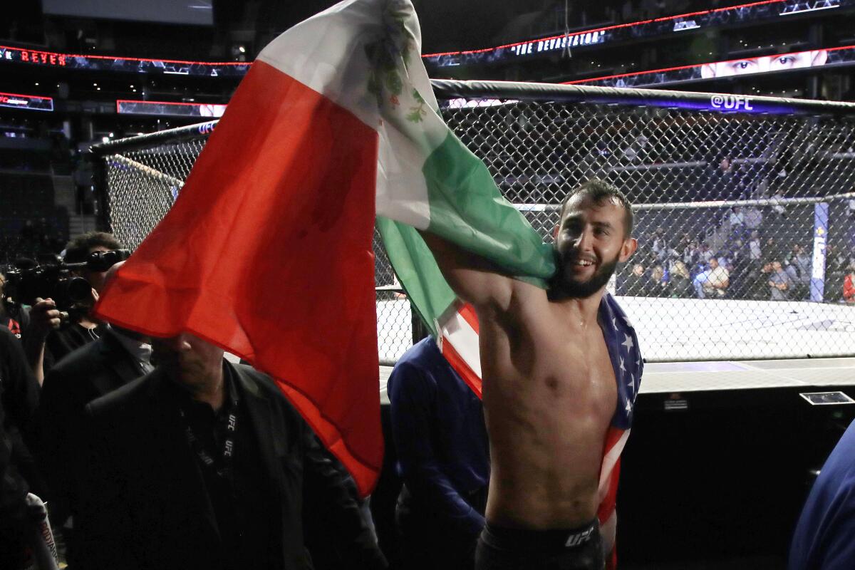 Dominick Reyes celebrates his victory over Chris Weldman in a light heavyweight mixed martial arts bout Friday, Oct. 18, 2019, at UFC Fight Night in Boston. (AP Photo/Elise Amendola)