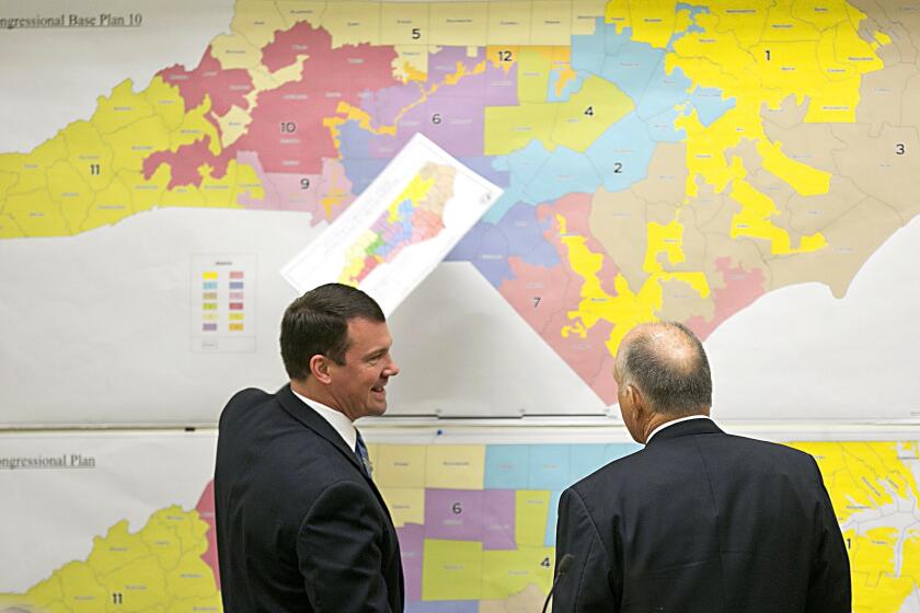 FILE - In this Tuesday, Feb. 16, 2016, file photo, Republican state Sens. Dan Soucek, left, and Brent Jackson review historical maps during The Senate Redistricting Committee for the 2016 Extra Session in the Legislative Office Building at the N.C. General Assembly, in Raleigh, N.C. North Carolina judges on Monday, Oct. 28, 2019, blocked the state's congressional map from being used in the 2020 elections, ruling that voters had a strong likelihood of winning a lawsuit that argued Republicans unlawfully manipulated district lines for partisan gain. (Corey Lowenstein/The News & Observer via AP, File)