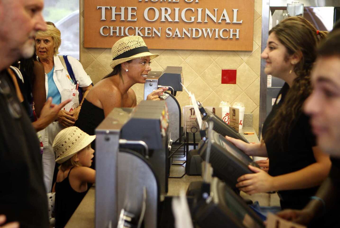 Tammy Weaver, center, places her order at the Chick-fil-A restaurant in Laguna Niguel. Supporters of the company whose executives made comments about gay marriage turned out in huge numbers here and across the nation. Weaver, who drove 20 miles from her home in Ladera Ranch to support the cause said, "I'm in favor of Biblical marriage."
