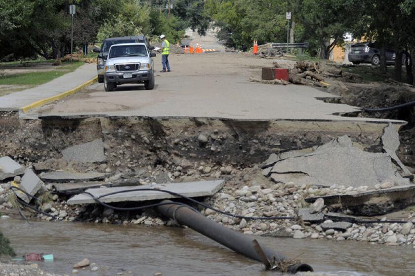 This photo shows a road that was washed out by the flood in Lyons, Colo., on Sept. 19. The recovery process has begun all along the Front Range as people clean out flooded homes and businesses. Local governments are starting to clear debris and repair infrastructure.