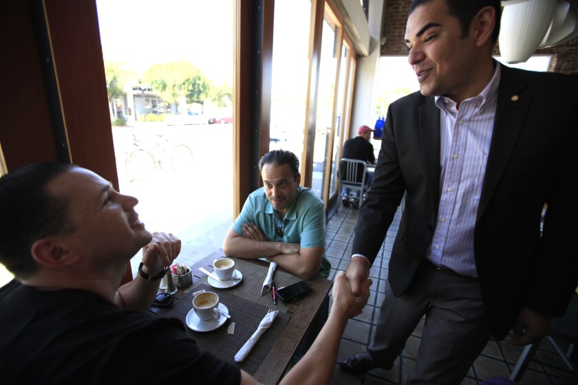 Robert Garcia greets people at a Long beach coffee house, a day after being elected mayor.