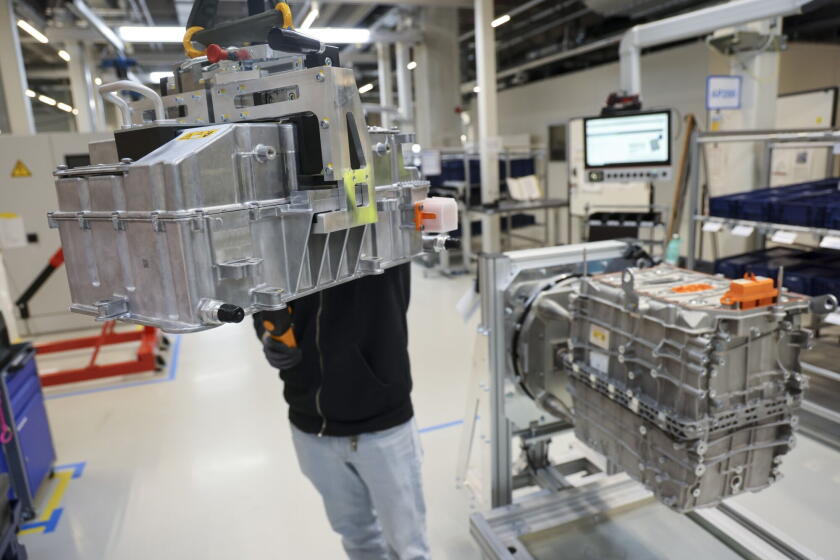 An employee assembles a fuel cell system for a heavy-duty truck in Esslingen, Germany. Photographer: Alex Kraus/Bloomberg