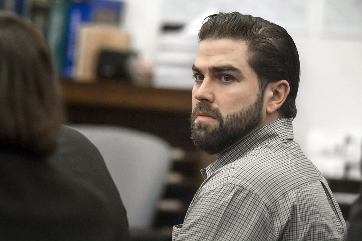 Daniel Wozniak listens to closing arguments during the penalty phase of his trial in Santa Ana on Monday.