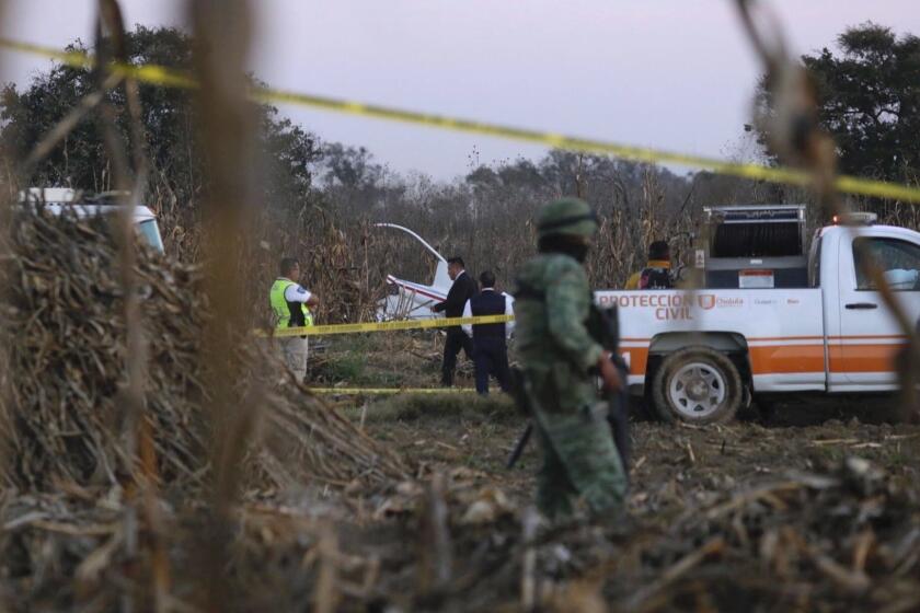 Mandatory Credit: Photo by HILDA RIOS/EPA-EFE/REX (10041111b) Authorities investigate the area where the remains of the helicopter carrying Governor of Puebla Martha Erika Alonso, and her husband, ex-governor of Puebla Rafael Moreno Valle, in Puebla, Mexico, 24 December 2018. The President of Mexico Andres Manuel Lopez Obrador confirmed that Governor of the state of Puebla Martha Erika Alonso, and her husband and former governor Rafael Moreno Valle, died when their helicopter crashed on Christmas Eve. Alonso assumed her role as Puebla governor two weeks ago. Her husband was governor of the state from 2011 to 2017. Governor of Puebla and her husband die in helicopter crash, Mexico - 24 Dec 2018 ** Usable by LA, CT and MoD ONLY **
