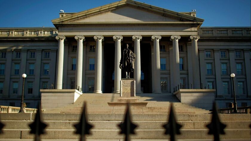 A statue of first Secretary of the Treasury Alexander Hamilton stands in front of the U.S. Treasury Department building in Washington, D.C., in March 2009.