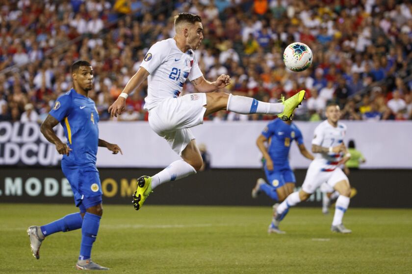 FILE - United States' Tyler Boyd (21) leaps for the ball during a CONCACAF Gold Cup soccer match against Curacao, June 30, 2019, in Philadelphia. Boyd signed a one-year contract with the LA Galaxy, Monday, Feb. 20, 2023. It will be Boyd’s first appearance in Major League Soccer after playing in New Zealand, Portugal and Turkey. (AP Photo/Matt Slocum, File)