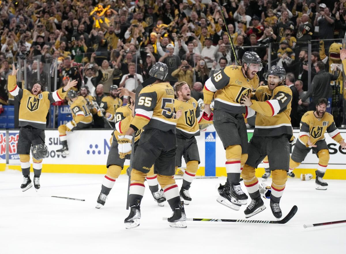 Members of the Vegas Golden Knights celebrate after defeating the Florida Panthers to win the Stanley Cup.