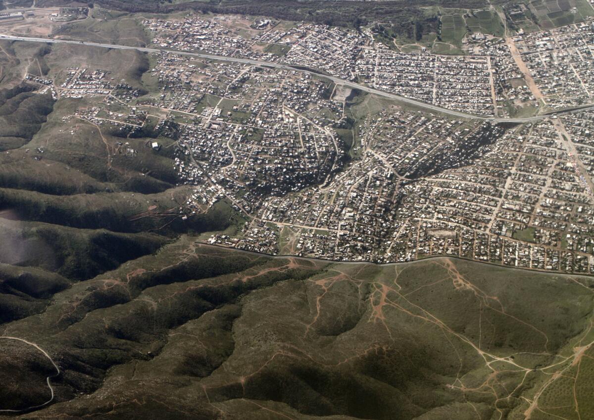 In San Diego County, trade seeps into every part of life; residents of both countries hop across the border for commutes, shopping and healthcare. Above, a view of the border on the eastern outskirts of Tijuana.