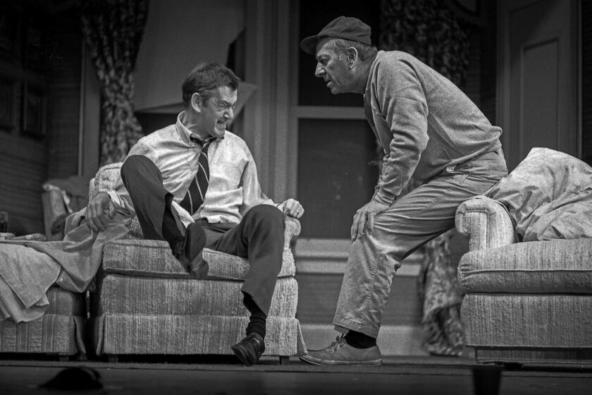 Dec. 4, 1975: Tony Randall, left, throws a fit as a concerned but relaxed Jack Klugman looks on in the "The Odd Couple," Neil Simon's comedy playing at the Shubert Theater. This photo appeared in the Dec. 4, 1975, Los Angeles Times. This image is from the Los Angeles Times Archive at UCLA.